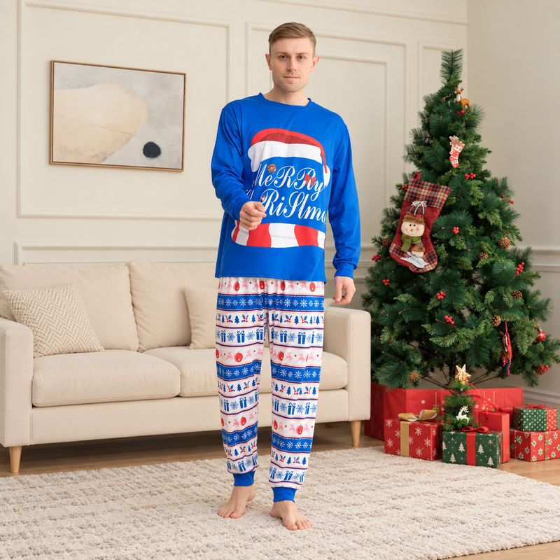 Family wearing blue Christmas pajamas with Santa hat graphic and snowflake print pants - view 3