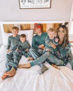 Family wearing matching green safari print Christmas pajamas - view 16