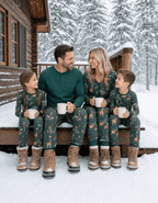 Family wearing matching green safari print Christmas pajamas - view 3