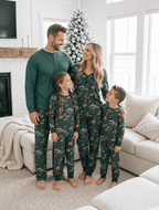 Family wearing matching green safari print Christmas pajamas - view 4