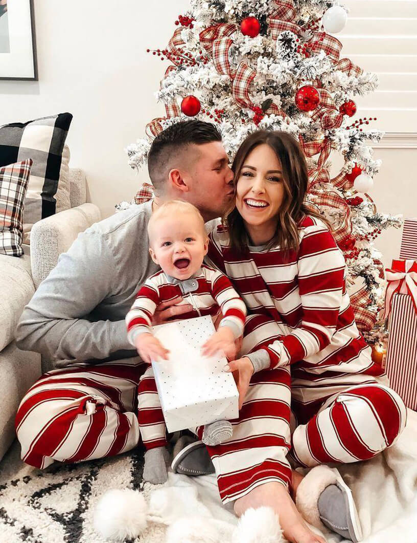 Red and white striped family matching Christmas pajamas with gray cuffs