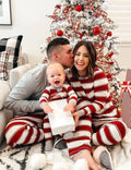 Red and white striped family matching Christmas pajamas with gray cuffs