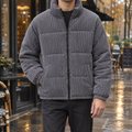 Padded corduroy jacket for men with quilted panels and high zip collar