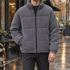 Padded corduroy jacket for men with quilted panels and high zip collar