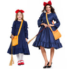 Girl wearing navy witch costume dress with puffed ruffle sleeves and ruffle hem