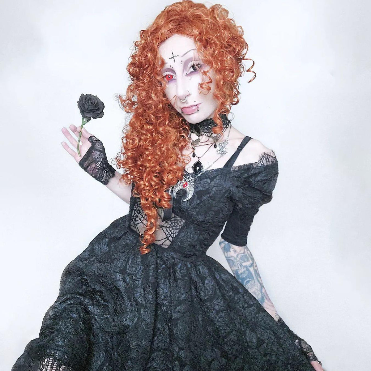 Gothic off-the-shoulder lace-trimmed dress with spiderweb mesh bodice and flared skirt