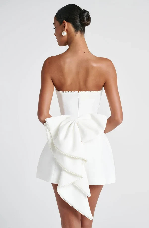 Strapless mini dress with pearl-trim neckline and oversized cascading back bow - view 11