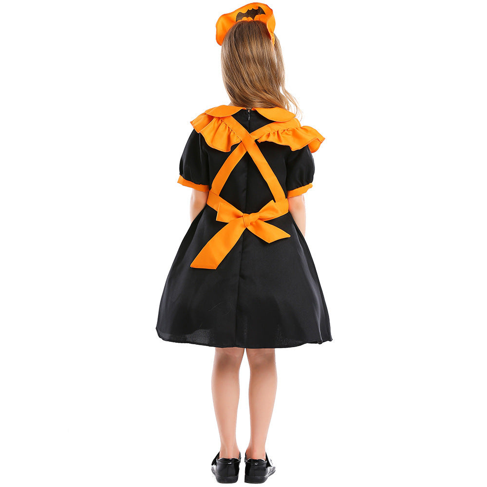 Girl wearing black puff-sleeve pumpkin Halloween costume dress with orange ruffled apron - view 5