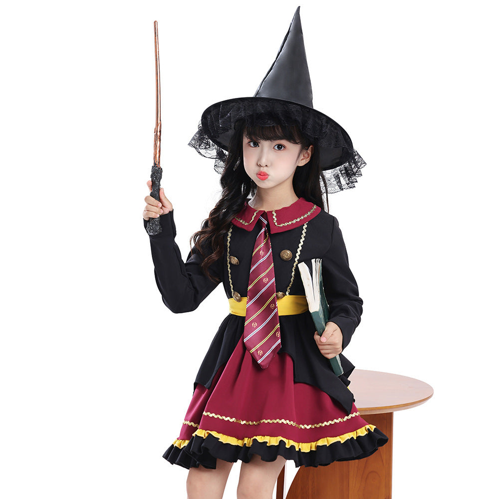Girl wearing a black and burgundy witch costume with striped tie, yellow sash, ruffled skirt and lace-trimmed pointed hat