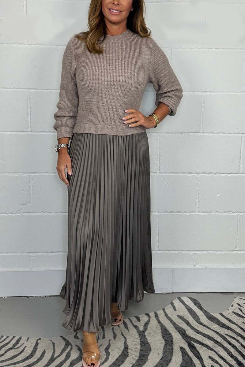 Woman wearing a long sleeve maxi sweater dress with ribbed knit top and pleated satin-look skirt