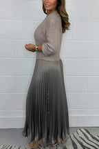 Woman wearing a long sleeve maxi sweater dress with ribbed knit top and pleated satin-look skirt - view 2