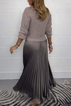 Woman wearing a long sleeve maxi sweater dress with ribbed knit top and pleated satin-look skirt - view 3