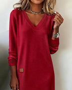 Woman wearing a relaxed V-neck midi sweater dress with raglan long sleeves and striped cuffs - view 8