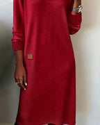 Woman wearing a relaxed V-neck midi sweater dress with raglan long sleeves and striped cuffs - view 9