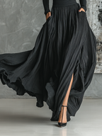 Black pleated maxi skirt set with fitted turtleneck top in motion - view 5