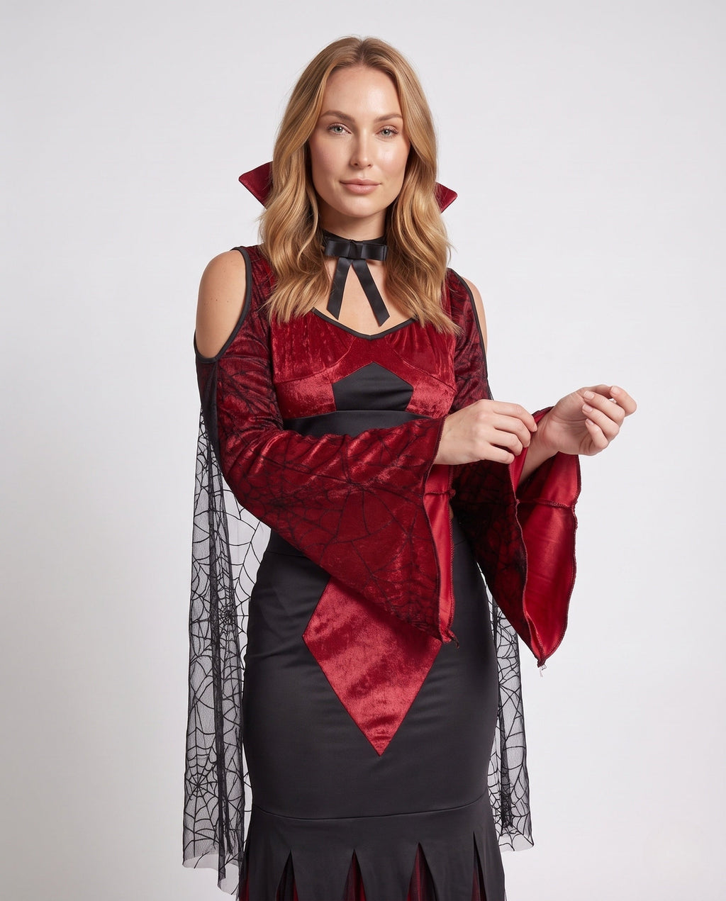 Women's two-piece vampire Halloween costume with red velvet crop top, spiderweb mesh bell sleeves and black jagged maxi skirt - view 2