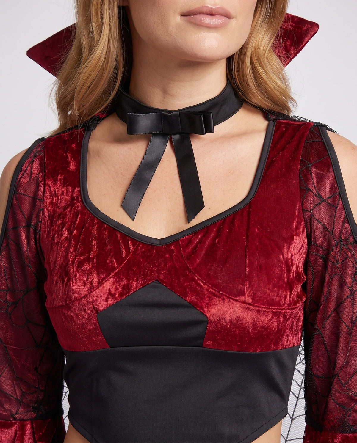 Women's two-piece vampire Halloween costume with red velvet crop top, spiderweb mesh bell sleeves and black jagged maxi skirt - view 3