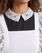 Women's black long sleeve maid Halloween costume with white lace-trimmed apron and lace collar - view 2