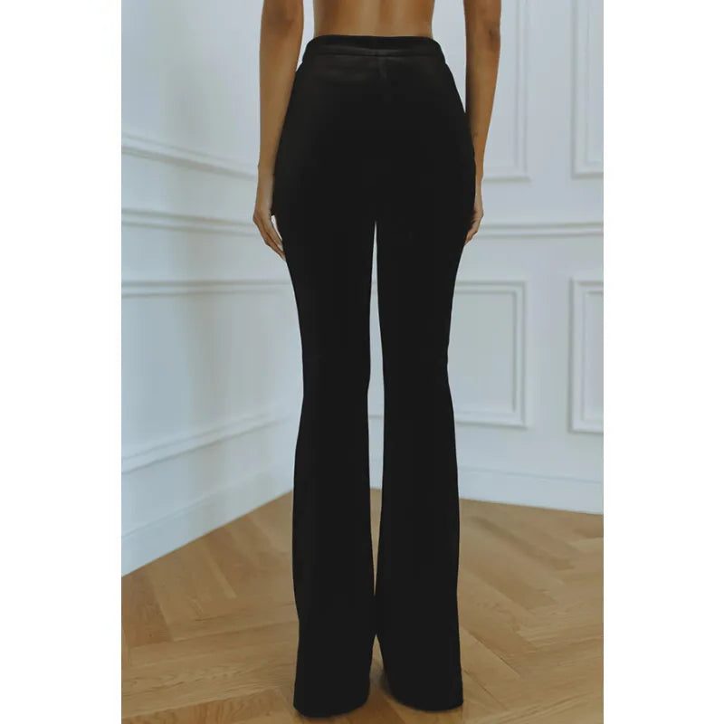 Woman wearing a red velvet suit with satin peak lapel blazer and flare pants - view 10