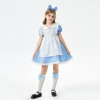 Girl wearing a blue costume dress with white apron, Peter Pan collar, puff sleeves and lace-trimmed hem - view 2