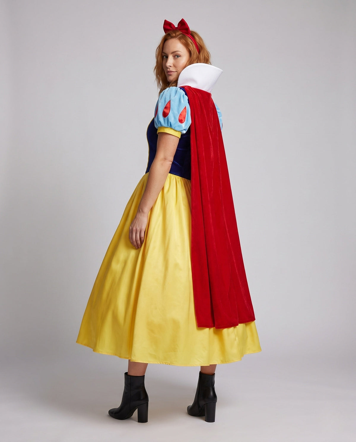 Women's fairytale princess Halloween costume with navy velvet bodice, blue puff sleeves, red cape, white collar and yellow skirt - view 3