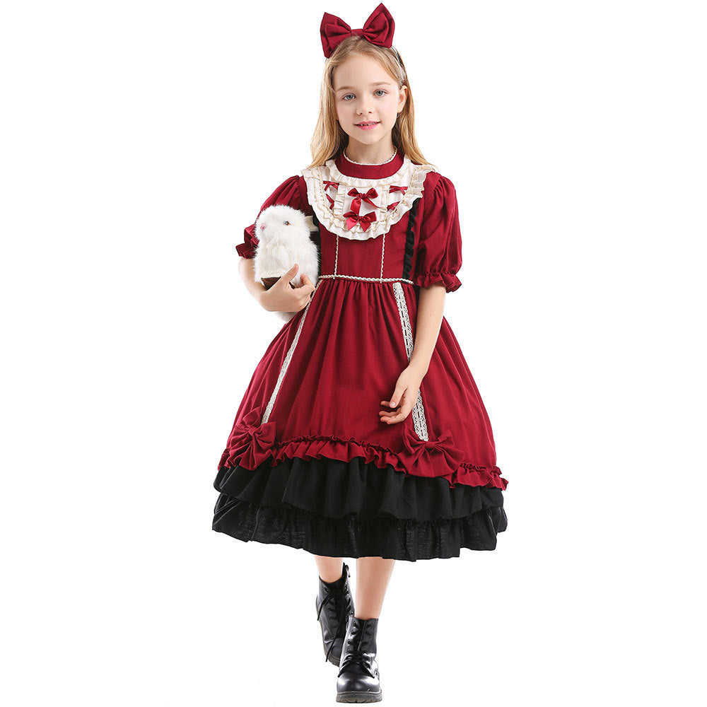 Girls red costume dress with ivory ruffled bib, red bows and black tiered ruffle hem