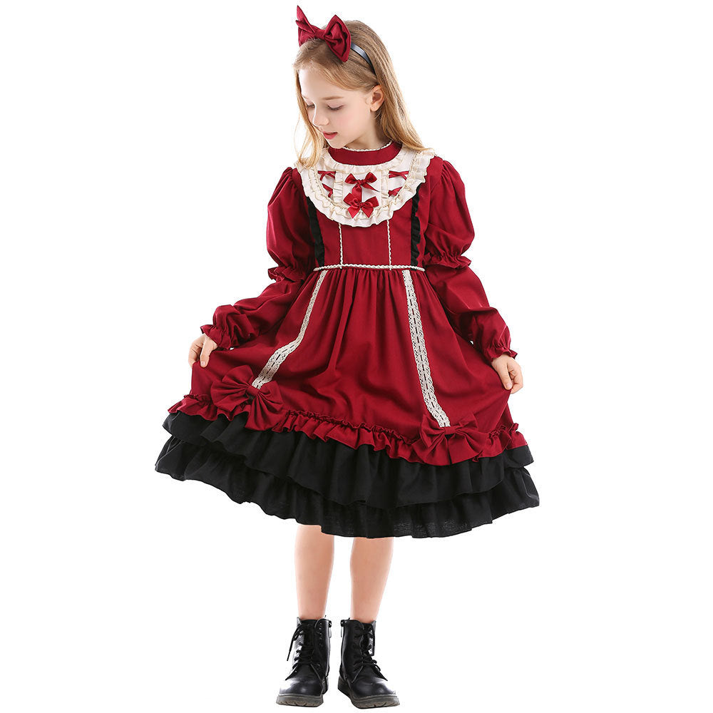 Girls red costume dress with ivory ruffled bib, red bows and black tiered ruffle hem - view 3
