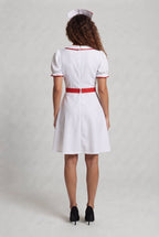 Women's white nurse Halloween costume dress with red trim and red cross apron - view 3