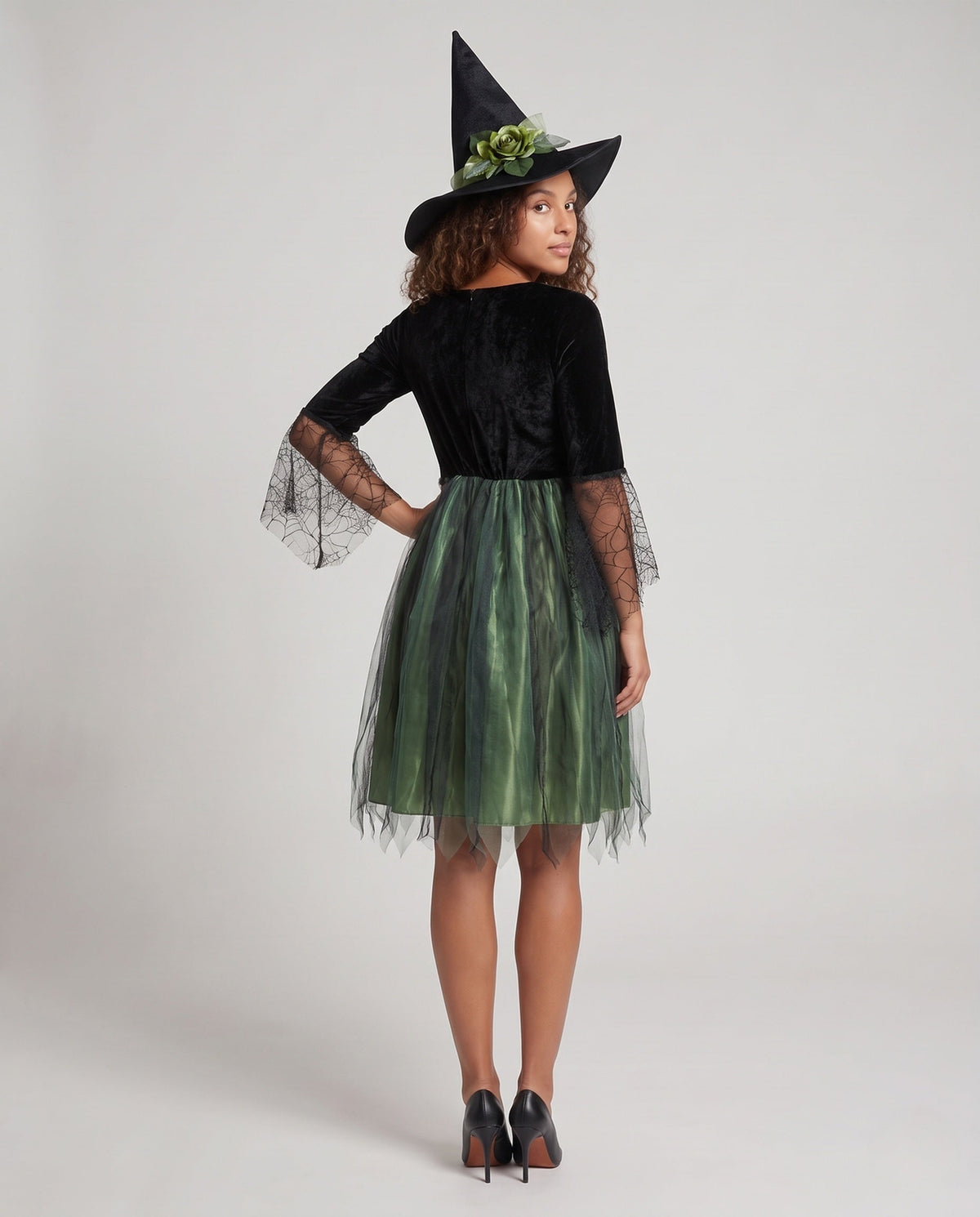 Women's witch Halloween costume with black velvet bodice, spiderweb lace bell sleeves and green tulle skirt - view 3
