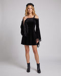 Black velvet mini dress with lace bell sleeves and cold-shoulder neckline