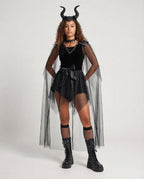 Women's black velvet Halloween costume dress with sheer tulle cape and studded shoulders