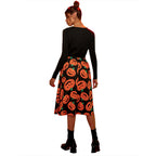 Black long sleeve midi dress with orange pumpkin print skirt - view 2
