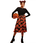 Black long sleeve midi dress with orange pumpkin print skirt - view 5