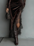 Woman wearing a brown turtleneck velvet dress with black lace slit and asymmetric hem - view 3