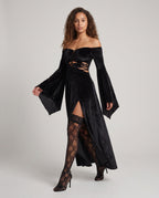 Black velvet off-the-shoulder maxi dress with bell sleeves and lace-up cutout bodice