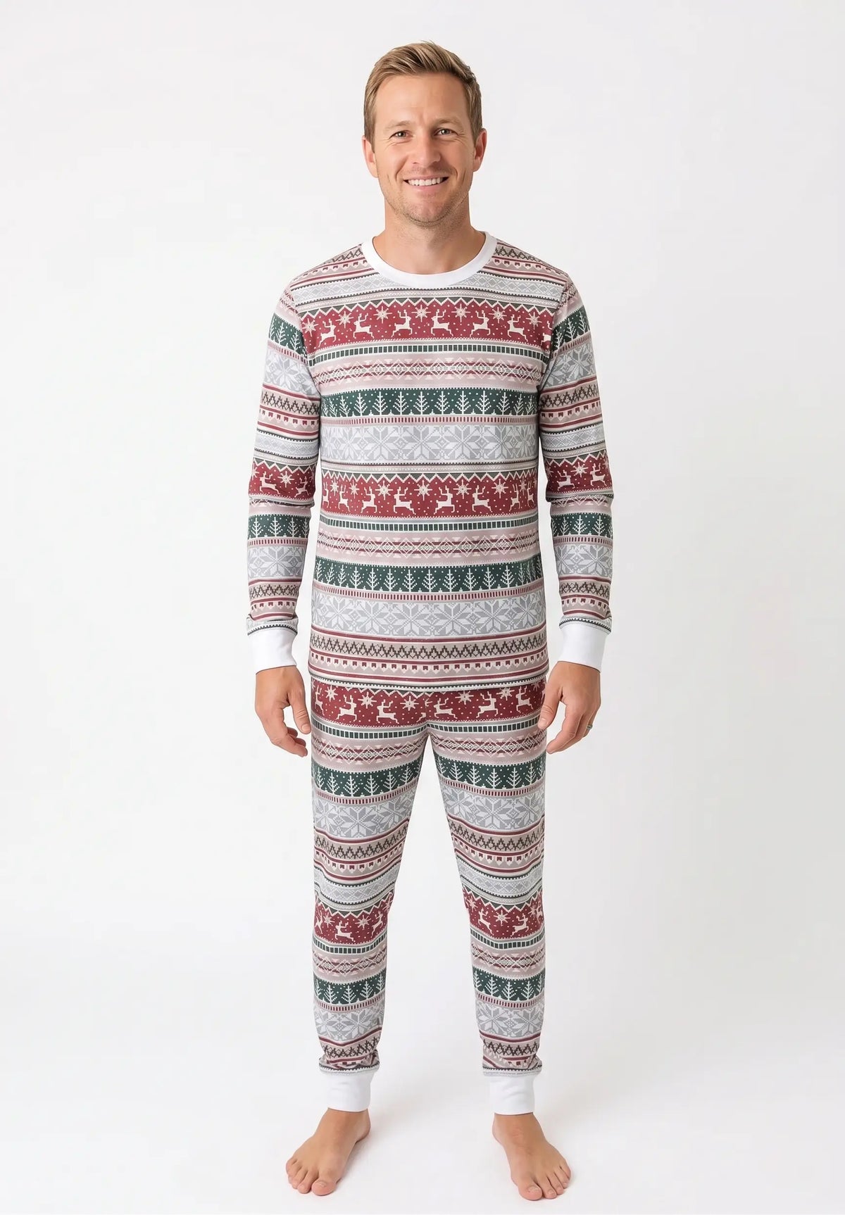 Family wearing matching gray Fair Isle Christmas pajamas with red reindeer and green tree stripes - view 9