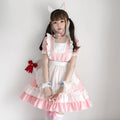 Women's pink and white ruffled maid-style Halloween costume dress with apron overlay and puff sleeves