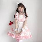 Women's pink and white ruffled maid-style Halloween costume dress with apron overlay and puff sleeves