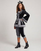 Women's black velvet jester Halloween costume with checkered panels and pom-pom peplum
