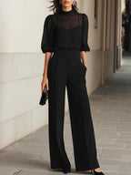 Women's black wide leg pants set with sheer puff sleeve mock neck top