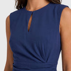 Sleeveless navy blue keyhole cocktail dress with ruched waist and faux wrap skirt - view 3