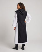 Women's nun Halloween costume with black hooded tabard over white long-sleeve robe - view 3