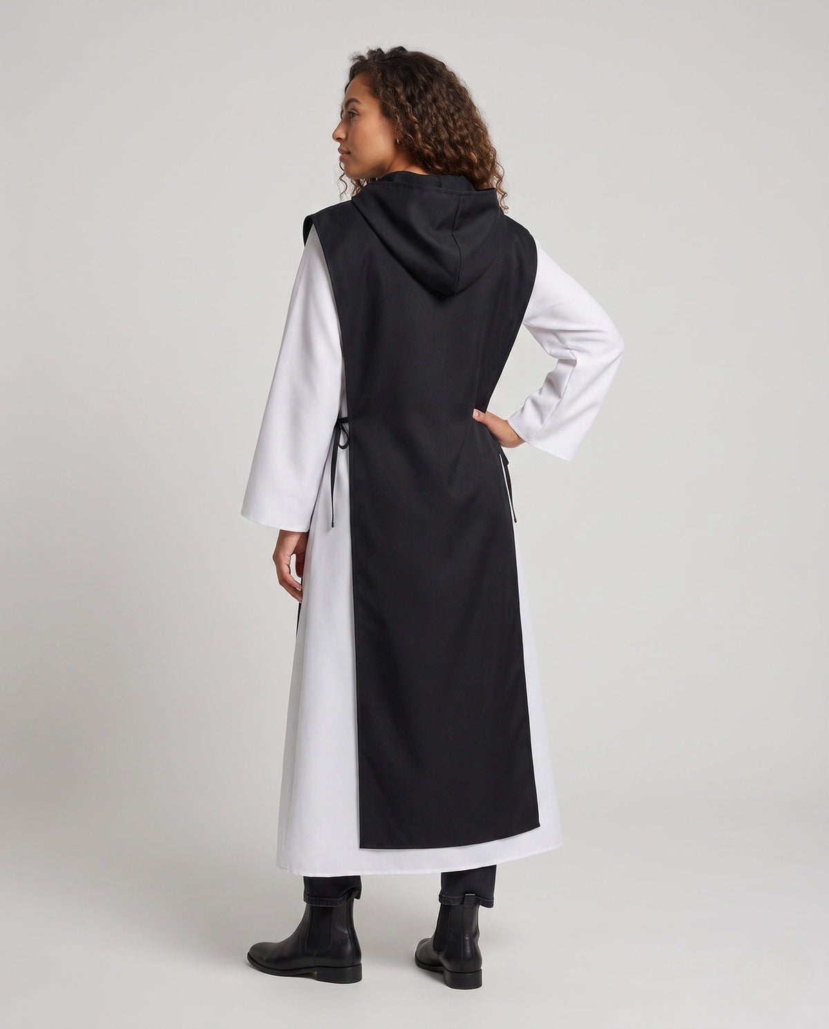 Women's nun Halloween costume with black hooded tabard over white long-sleeve robe - view 3