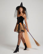 Women's witch Halloween costume with black velvet corset bodice and layered orange tulle skirt with train