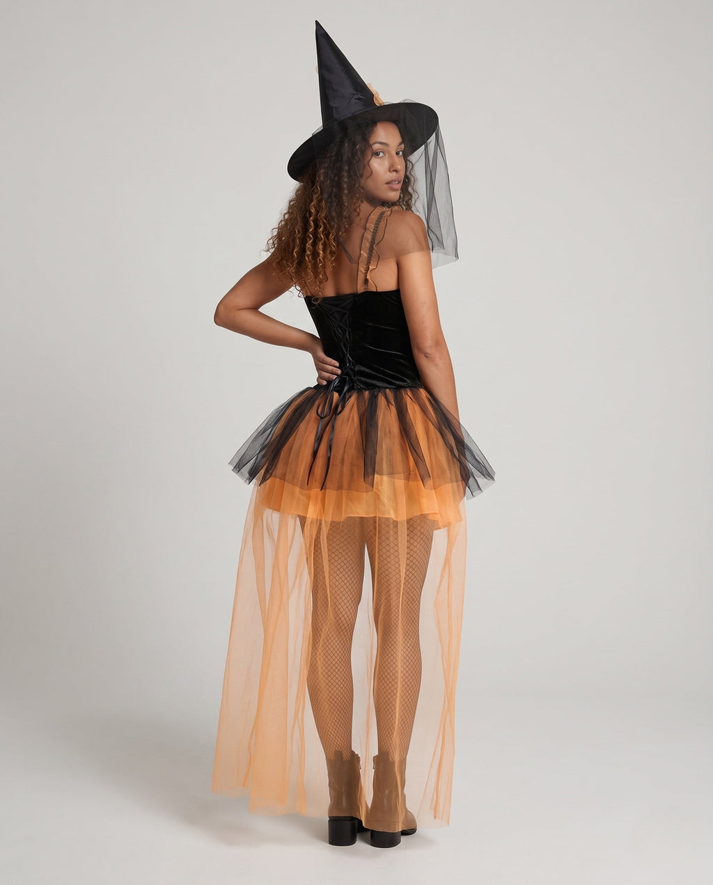 Women's witch Halloween costume with black velvet corset bodice and layered orange tulle skirt with train - view 3