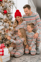 Family wearing matching fair isle Christmas pajamas with reindeer and tree print - view 2