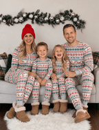 Family wearing matching fair isle Christmas pajamas with reindeer and tree print - view 3