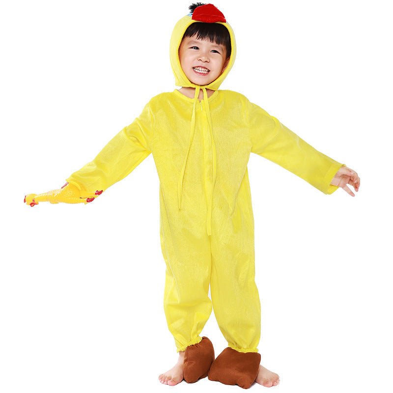 Child wearing a yellow plush duck Halloween costume with beaked hood and brown feet covers