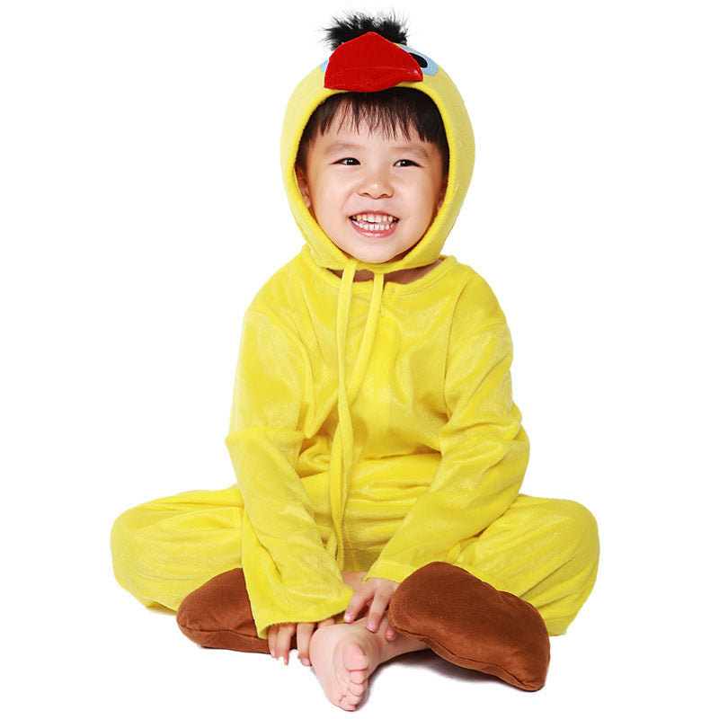 Child wearing a yellow plush duck Halloween costume with beaked hood and brown feet covers - view 6