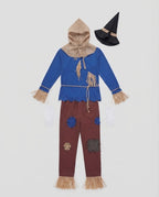 Men's scarecrow Halloween costume with blue fringed top, burlap-look hood, patched red pants, black hat and white gloves - view 4